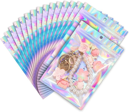 ANZNKU 100 Pack Mylar Bags Reasealable Holographic Bags, Smell Proof Bag Zipper Pouches with Clear Window, Jewelry Candy Sealable Bag for Packaging Sample Party Favor (4.7 x 7.9 Inch)